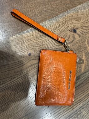 Michael Kors Orange Pebbled Leather Wristlet with Gold Hardware